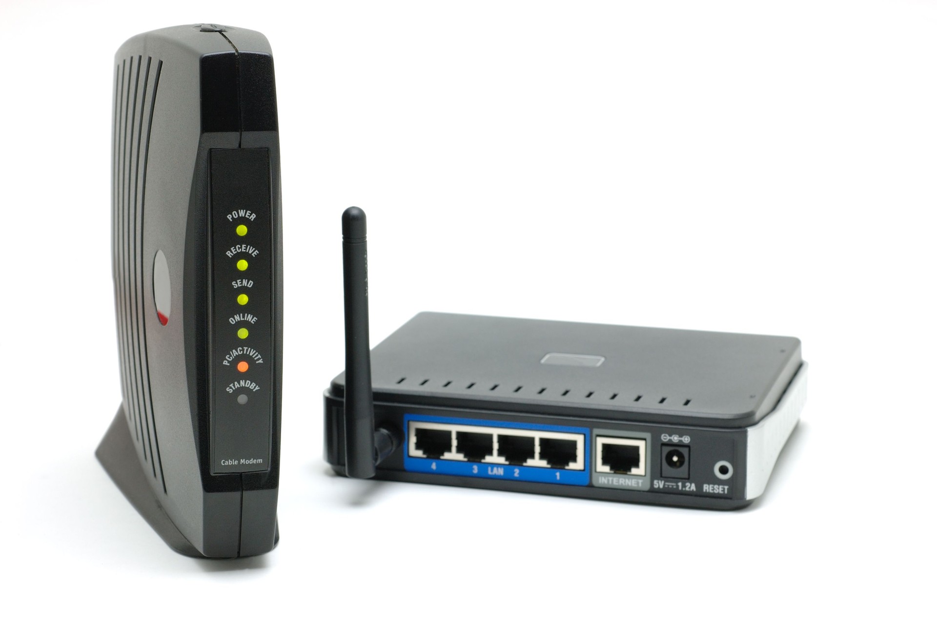 A cable modem and router isolated on a white background